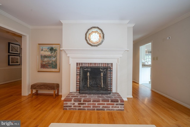 431 Waynesbrooke Rd, Berwyn, PA 19312 - detailed view of wood finished floors, crown molding, and a fireplace