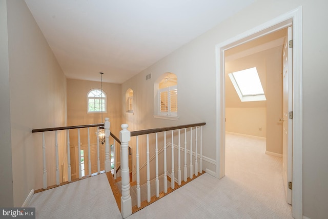 431 Waynesbrooke Rd, Berwyn, PA 19312 - hallway with carpet flooring, an upstairs landing, and a skylight