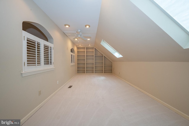 431 Waynesbrooke Rd, Berwyn, PA 19312 - bonus room with built in shelves, a skylight, lofted ceiling, a ceiling fan, and recessed lighting