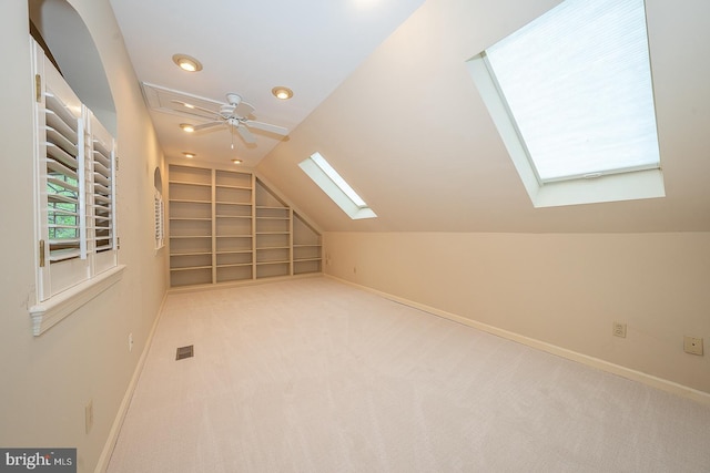 431 Waynesbrooke Rd, Berwyn, PA 19312 - bonus room with a skylight, built in features, vaulted ceiling, carpet flooring, and ceiling fan
