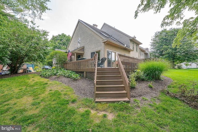 431 Waynesbrooke Rd, Berwyn, PA 19312 - rear view of property featuring a lawn, a deck, stairs, and stucco siding