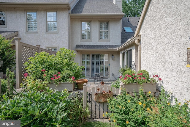 431 Waynesbrooke Rd, Berwyn, PA 19312 - back of house with stucco siding, roof with shingles, and a patio