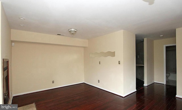 13406 Shady Knoll Dr Unit 105/G1, Silver Spring, MD 20904 - spare room featuring dark wood-style floors and baseboards