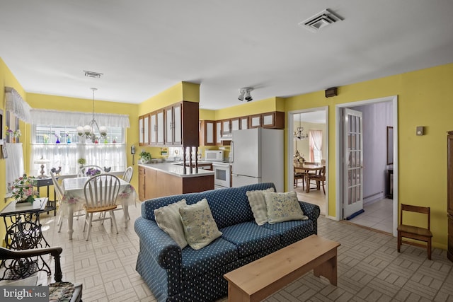 59 Saint Davids Pl, Southampton, NJ 08088 - living area featuring a chandelier