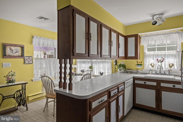 59 Saint Davids Pl, Southampton, NJ 08088 - kitchen with white dishwasher, light countertops, a peninsula, and baseboard heating