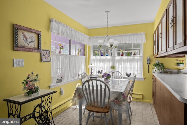59 Saint Davids Pl, Southampton, NJ 08088 - dining space featuring a baseboard radiator, a chandelier, and healthy amount of natural light