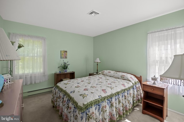 59 Saint Davids Pl, Southampton, NJ 08088 - carpeted bedroom with a baseboard heating unit and multiple windows