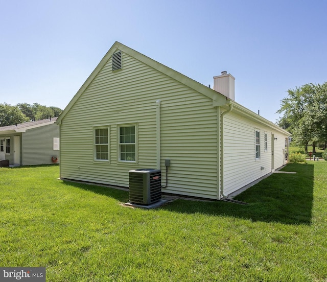 59 Saint Davids Pl, Southampton, NJ 08088 - view of property exterior featuring a chimney and a yard