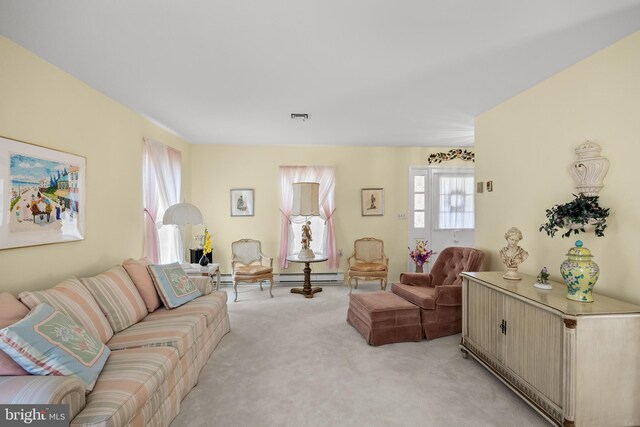 59 Saint Davids Pl, Southampton, NJ 08088 - living room with light colored carpet and a baseboard heating unit