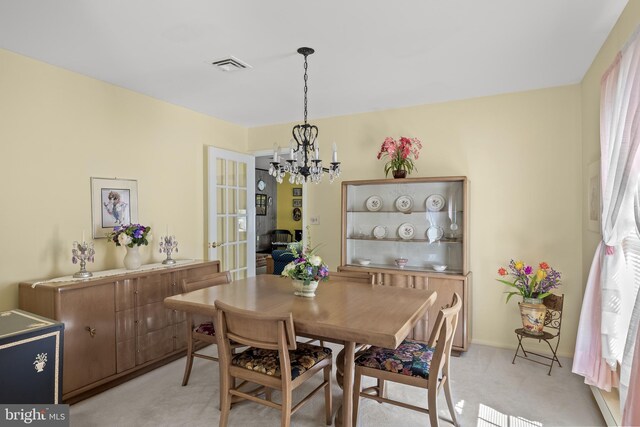 59 Saint Davids Pl, Southampton, NJ 08088 - dining space with a chandelier and light colored carpet