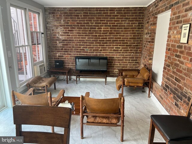 23 E Beverley St, Staunton, VA 24401 - living room with brick wall and a fireplace