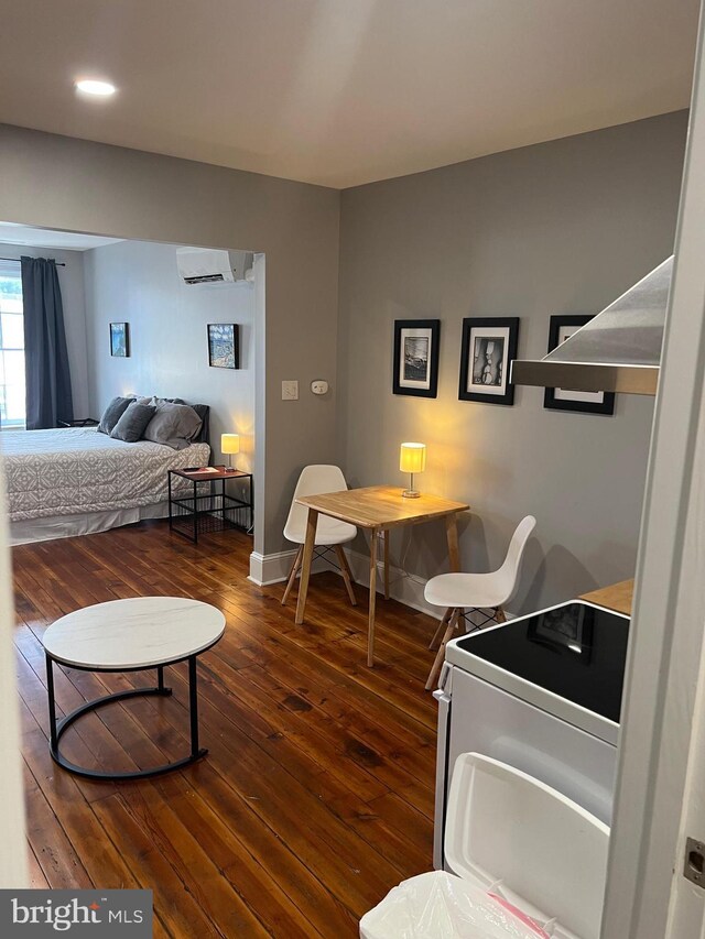 23 E Beverley St, Staunton, VA 24401 - bedroom featuring hardwood / wood-style flooring and a wall mounted AC