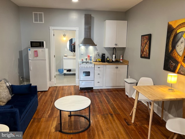 23 E Beverley St, Staunton, VA 24401 - living area with dark wood-style flooring and recessed lighting