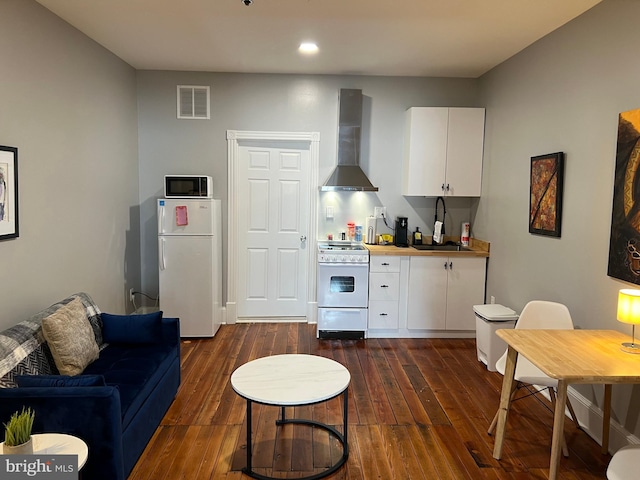 23 E Beverley St, Staunton, VA 24401 - living area with dark wood-type flooring and recessed lighting