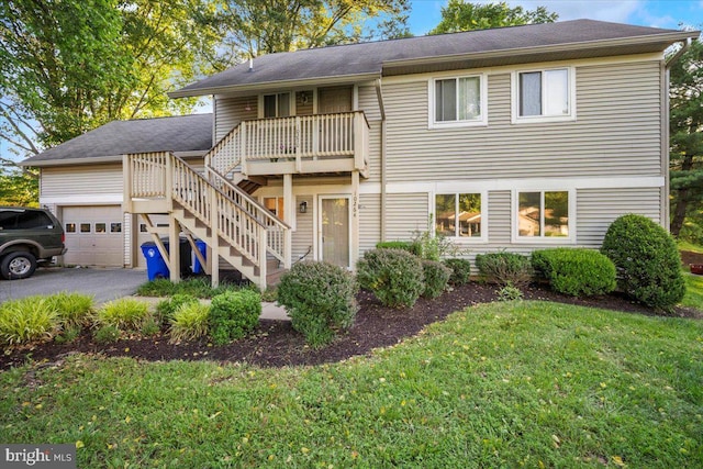 10264 Redtail Ct Unit 10264A, New Market, MD 21774 - view of front of property featuring a garage, stairway, a front lawn, asphalt driveway, and roof with shingles
