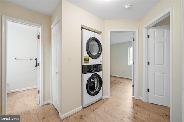 10264 Redtail Ct Unit 10264A, New Market, MD 21774 - washroom with stacked washing machine and dryer and light wood-style floors