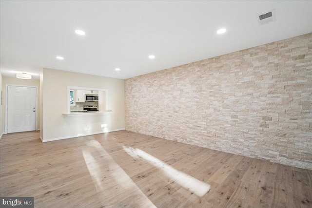 10264 Redtail Ct Unit 10264A, New Market, MD 21774 - unfurnished living room with wood finished floors and recessed lighting