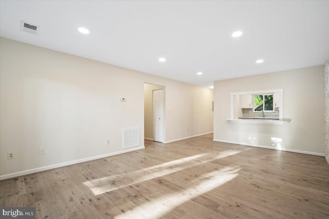 10264 Redtail Ct Unit 10264A, New Market, MD 21774 - unfurnished living room with wood finished floors and recessed lighting