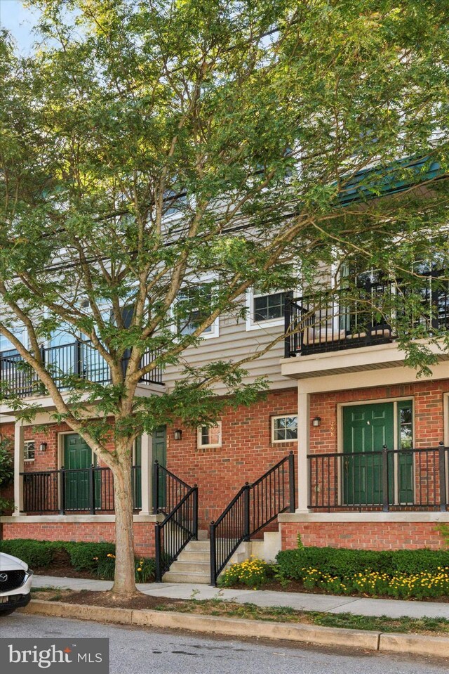 300 Jefferson Ave Unit 13, Downingtown, PA 19335 - view of front of home with a balcony and brick siding