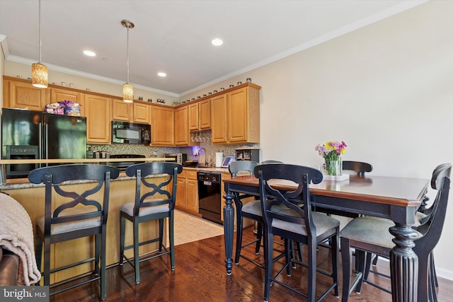300 Jefferson Ave Unit 13, Downingtown, PA 19335 - kitchen featuring black appliances, backsplash, crown molding, pendant lighting, and a kitchen bar