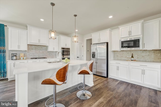 6071 Fallfish Ct, New Market, MD 21774 - kitchen with stainless steel fridge, built in microwave, tasteful backsplash, gas stovetop, and recessed lighting