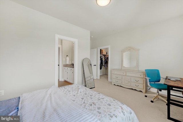6071 Fallfish Ct, New Market, MD 21774 - bedroom featuring a walk in closet, light carpet, a closet, and connected bathroom