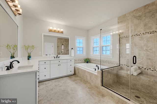 6071 Fallfish Ct, New Market, MD 21774 - bathroom featuring a bath, two vanities, a shower stall, and tile patterned floors