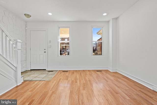 3402 Elmley Ave, Baltimore, MD 21213 - foyer entrance with wood finished floors, stairs, and recessed lighting