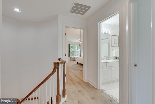 2153 Wolftrap Ct, Vienna, VA 22182 - hall with light wood finished floors, an upstairs landing, and recessed lighting