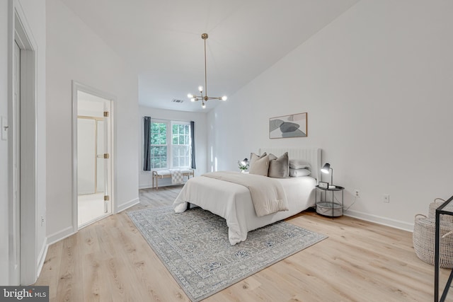 2153 Wolftrap Ct, Vienna, VA 22182 - bedroom featuring wood finished floors, a chandelier, and high vaulted ceiling