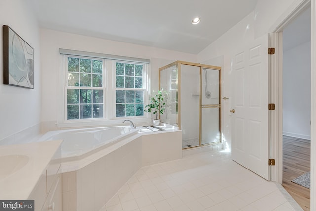 2153 Wolftrap Ct, Vienna, VA 22182 - bathroom with a garden tub, a shower stall, vanity, tile patterned floors, and recessed lighting