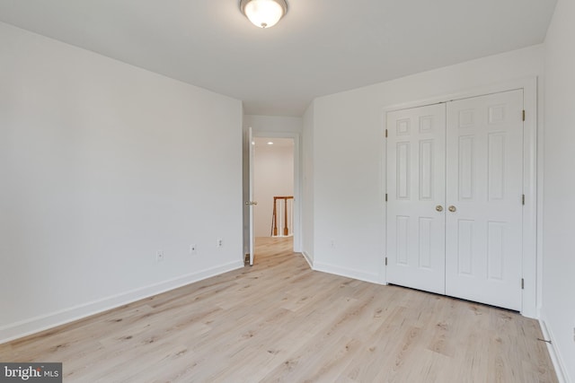2153 Wolftrap Ct, Vienna, VA 22182 - unfurnished bedroom featuring light wood-type flooring and a closet