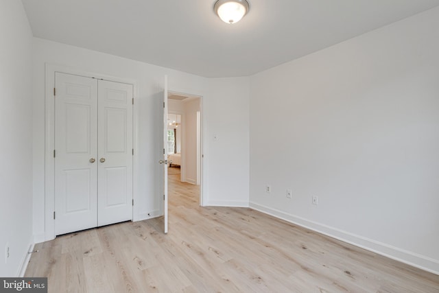 2153 Wolftrap Ct, Vienna, VA 22182 - unfurnished bedroom featuring light wood finished floors and a closet