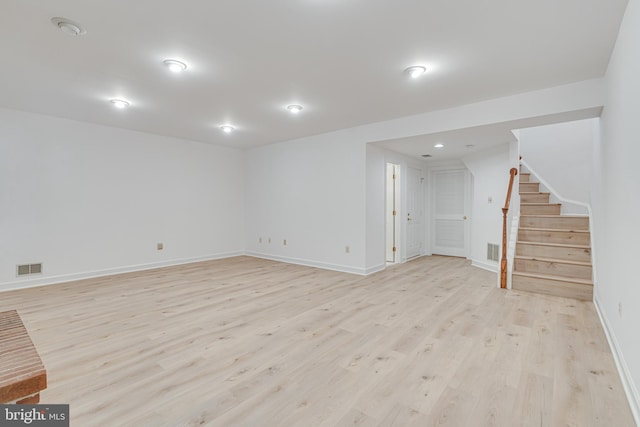 2153 Wolftrap Ct, Vienna, VA 22182 - below grade area with light wood-type flooring and stairway
