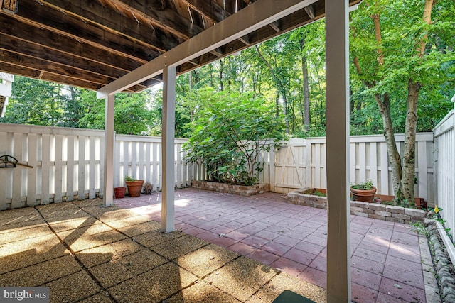 2153 Wolftrap Ct, Vienna, VA 22182 - fenced backyard featuring a patio area and a gate