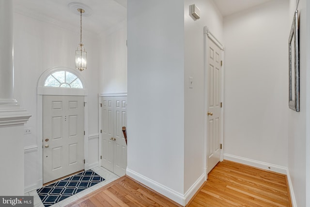 2153 Wolftrap Ct, Vienna, VA 22182 - foyer with light wood-style flooring and a chandelier