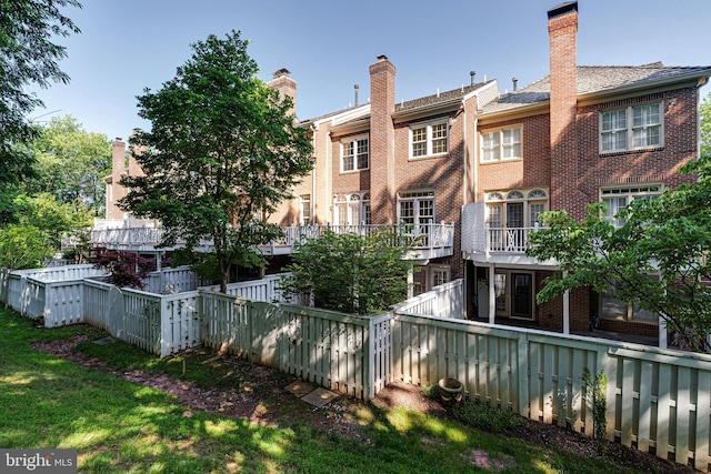 2153 Wolftrap Ct, Vienna, VA 22182 - rear view of house featuring brick siding and a chimney