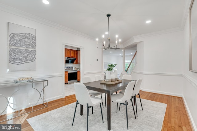 2153 Wolftrap Ct, Vienna, VA 22182 - dining area featuring a chandelier, light wood-style flooring, ornamental molding, stairway, and recessed lighting