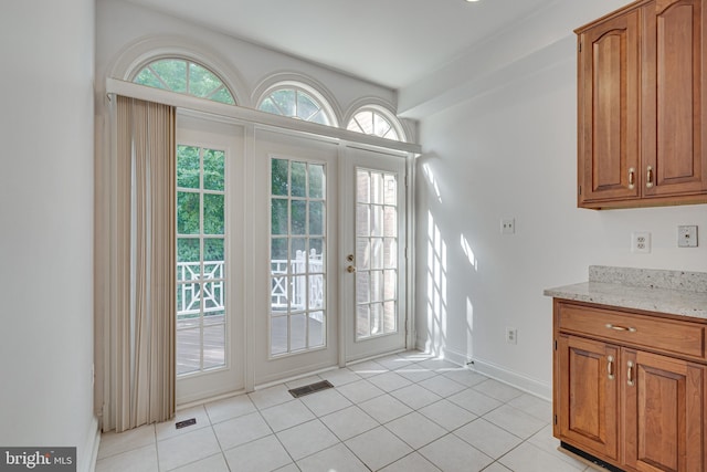 2153 Wolftrap Ct, Vienna, VA 22182 - doorway with baseboards and light tile patterned floors