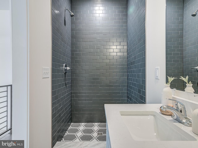 2103 E Cumberland St, Philadelphia, PA 19125 - full bath with a tile shower, vanity, and tile patterned flooring