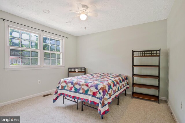 3077 Eutaw Forest Dr, Waldorf, MD 20603 - carpeted bedroom featuring a textured ceiling and ceiling fan