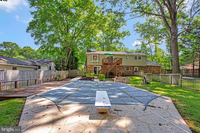 3077 Eutaw Forest Dr, Waldorf, MD 20603 - back of house featuring a fenced backyard, a wooden deck, brick siding, a patio, and stairs