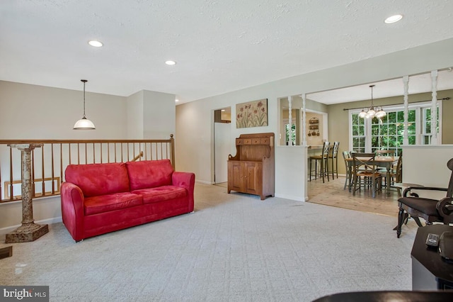 3077 Eutaw Forest Dr, Waldorf, MD 20603 - carpeted living room featuring recessed lighting, a textured ceiling, and a chandelier