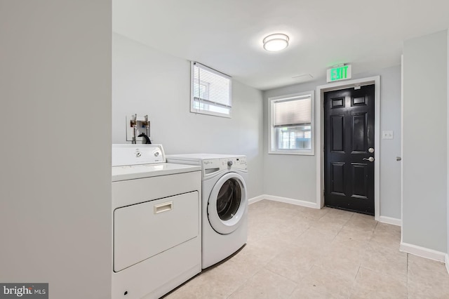 1901 Gwynns Falls Pkwy, Baltimore, MD 21217 - laundry room with washing machine and dryer and light tile patterned flooring