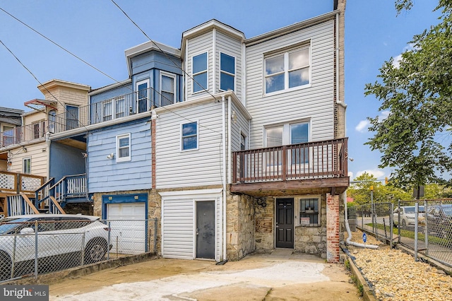 1901 Gwynns Falls Pkwy, Baltimore, MD 21217 - rear view of property featuring stone siding and an attached garage