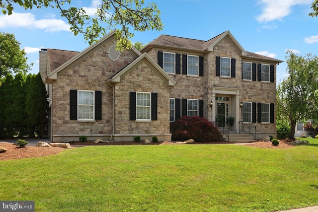3960 Mountain View Ave, Easton, PA 18045 - colonial home featuring a front yard, stone siding, and a chimney