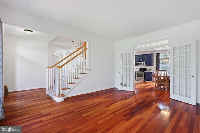 3960 Mountain View Ave, Easton, PA 18045 - spare room with french doors, dark wood-style flooring, stairway, ornamental molding, and a chandelier