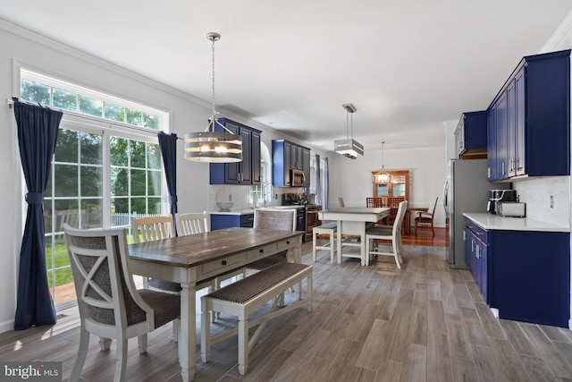 3960 Mountain View Ave, Easton, PA 18045 - dining room featuring light wood-type flooring and crown molding