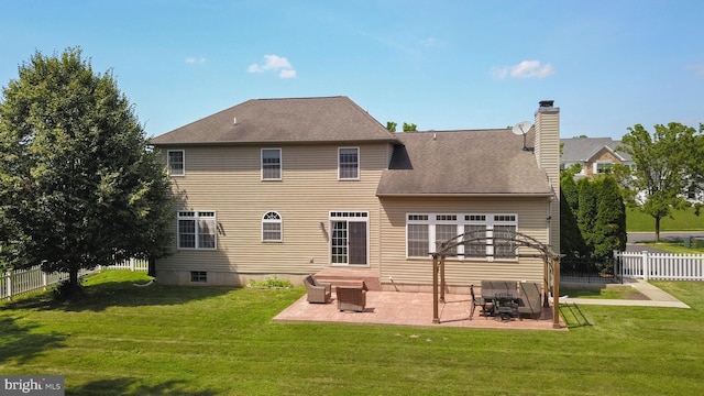 3960 Mountain View Ave, Easton, PA 18045 - back of house featuring a chimney, a patio area, and a shingled roof