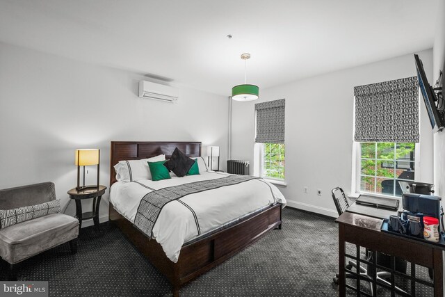 210 S High St, Baltimore, MD 21202 - bedroom with an AC wall unit, radiator, carpet floors, and a desk